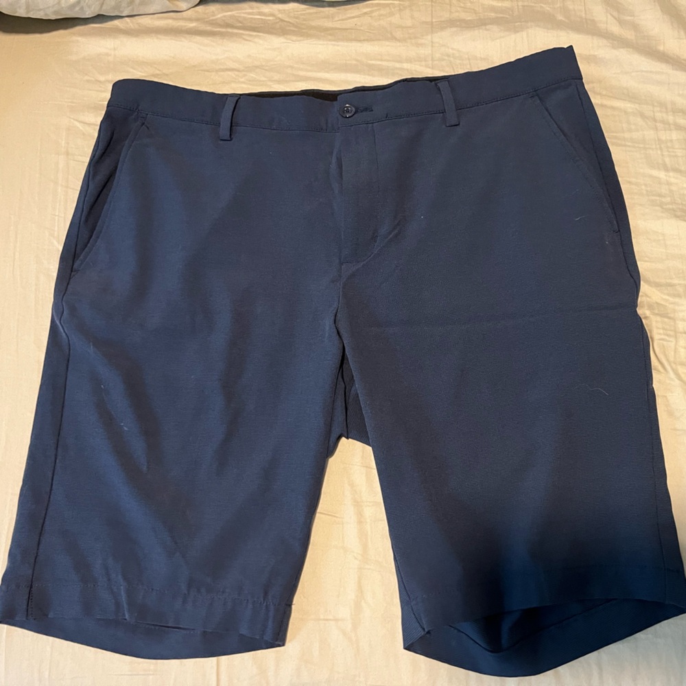 Greg Norman - golf shorts -size 36” waist and 9” inseam.